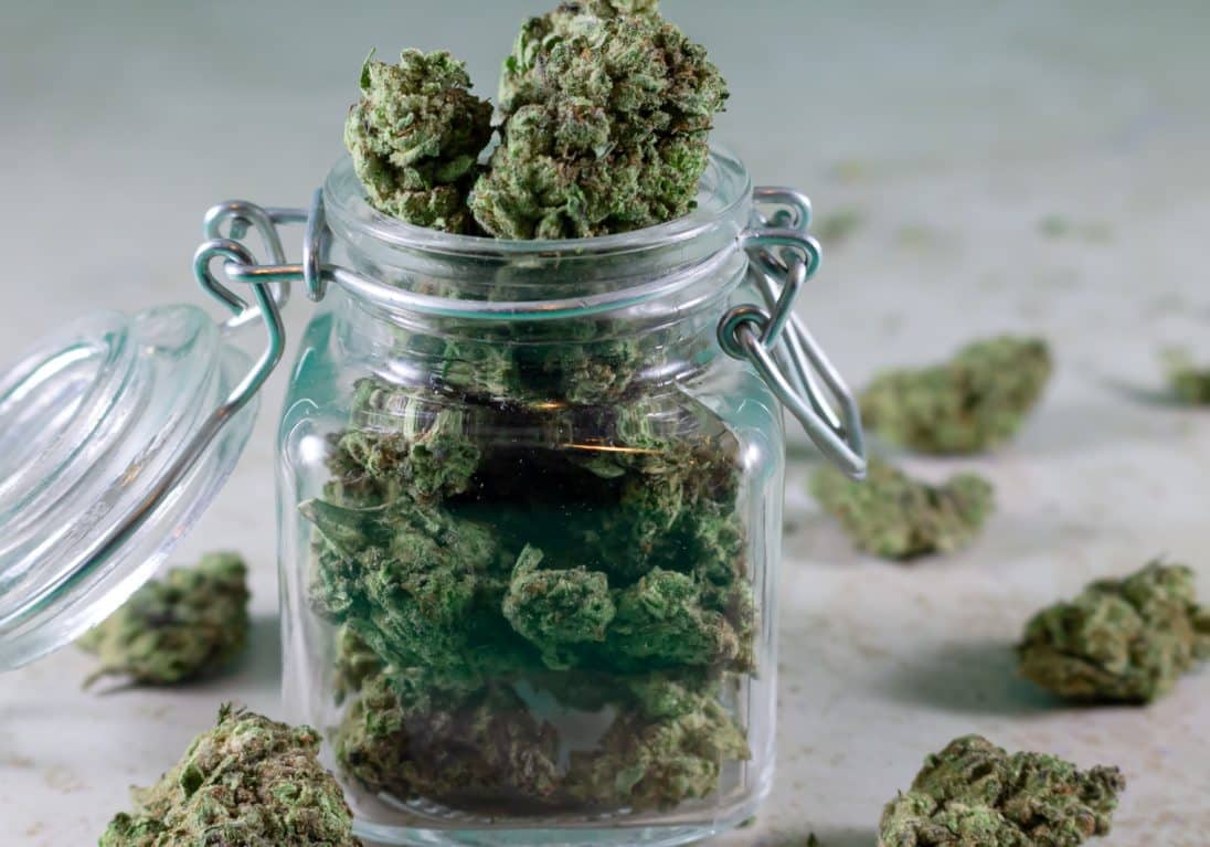 Marijuana flower in a glass container